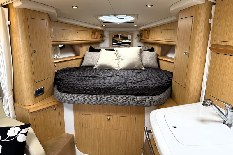  Yacht Photos Pics Luxurious 2013 Four Winns Vista 375 cabin interior with cozy bed and modern amenities.