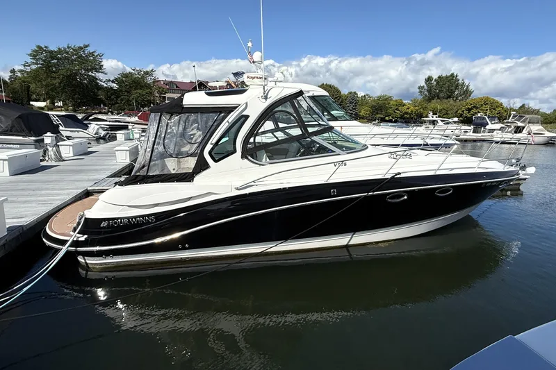  Yacht Photos Pics 2013 Four Winns Vista 375 boat docked at marina under clear blue sky.