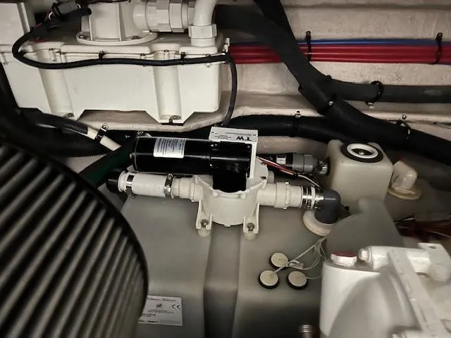  Yacht Photos Pics Engine compartment of a 2014 Sea Ray 410 Sundancer boat, showcasing mechanical components.