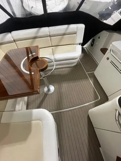  Yacht Photos Pics 2014 Sea Ray 410 Sundancer interior with elegant seating and wooden table.