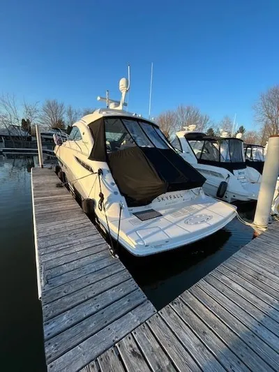  Yacht Photos Pics 2014 Sea Ray 410 Sundancer docked at marina under clear blue sky.