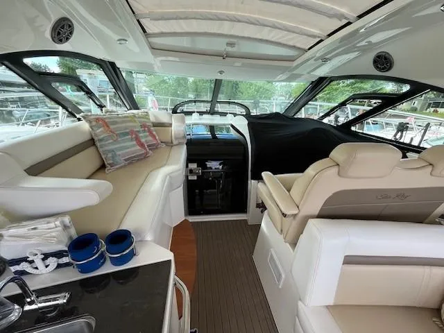  Yacht Photos Pics Interior of 2014 Sea Ray 410 Sundancer yacht with luxurious seating and helm.