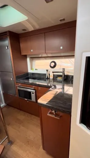  Yacht Photos Pics Luxurious kitchen interior of 2014 Sea Ray 410 Sundancer yacht with modern appliances.
