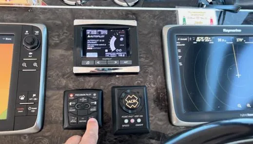  Yacht Photos Pics Control panel of a 2014 Sea Ray 410 Sundancer with navigation and autopilot systems.