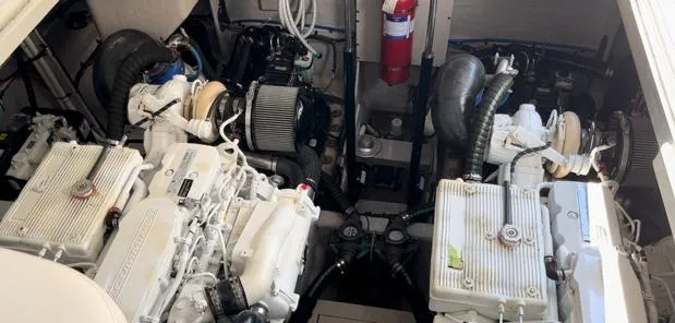  Yacht Photos Pics Engine room of 2014 Sea Ray 410 Sundancer with dual engines and fire extinguisher.