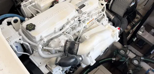  Yacht Photos Pics Engine compartment of a 2014 Sea Ray 410 Sundancer boat, showcasing detailed mechanical components.