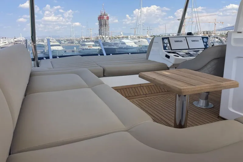 M/y Bishwish Yacht Photos Pics Luxurious Sunseeker Manhattan 66 yacht interior, featuring plush seating and modern navigation controls.