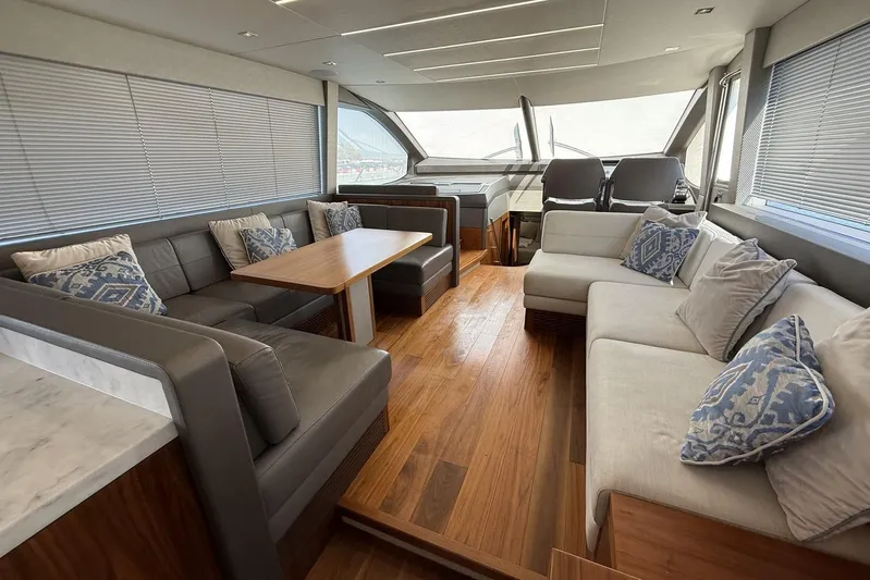 M/y Bishwish Yacht Photos Pics Luxurious interior of 2018 Sunseeker Manhattan 66 yacht with elegant seating and wooden flooring.