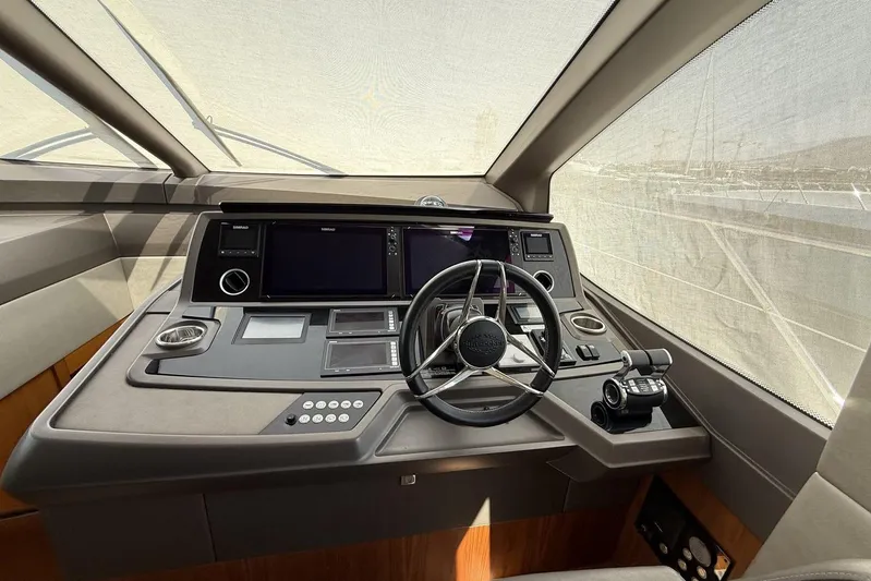 M/y Bishwish Yacht Photos Pics Helm of 2018 Sunseeker Manhattan 66 yacht with modern navigation controls and steering wheel.