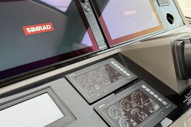 M/y Bishwish Yacht Photos Pics Control panel of a 2018 Sunseeker Manhattan 66 yacht with Simrad displays.