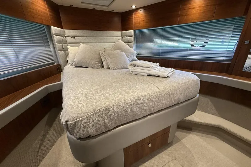 M/y Bishwish Yacht Photos Pics Luxurious bedroom interior of 2018 Sunseeker Manhattan 66 yacht with plush bedding.