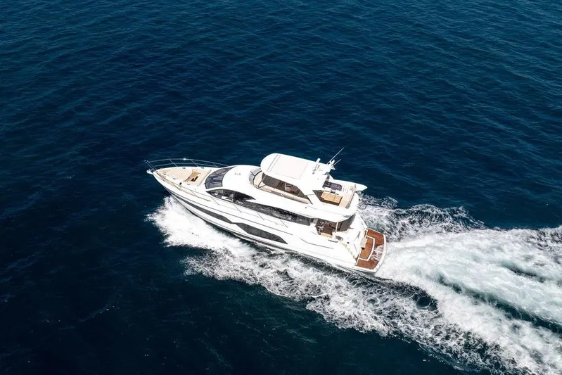 M/y Bishwish Yacht Photos Pics 2018 Sunseeker Manhattan 66 yacht cruising on open blue sea.