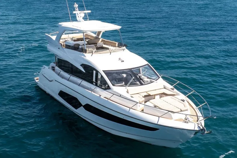 M/y Bishwish Yacht Photos Pics 2018 Sunseeker Manhattan 66 yacht cruising on open blue sea.