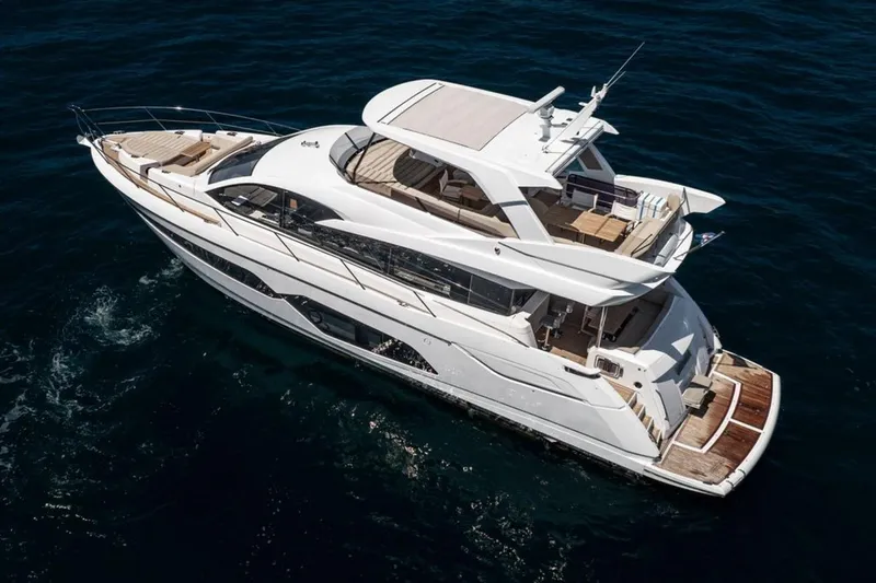 M/y Bishwish Yacht Photos Pics 2018 Sunseeker Manhattan 66 yacht cruising on open water, aerial view.