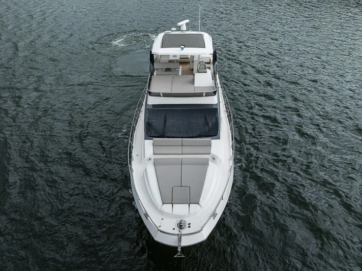 Harbour Time Yacht Photos Pics 2021 Astondoa 52 yacht on water, aerial view showcasing sleek design and spacious deck.