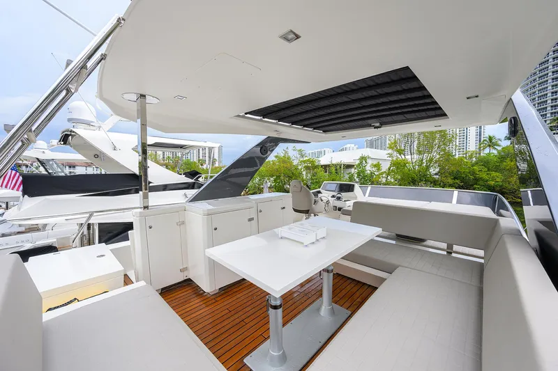Harbour Time Yacht Photos Pics Astondoa 52 yacht 2021 model, featuring a sleek outdoor seating area with modern design.