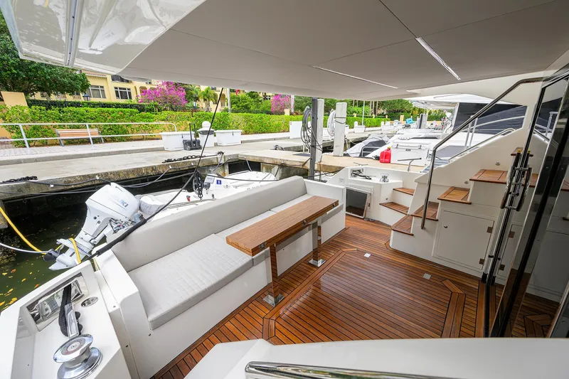 Harbour Time Yacht Photos Pics Luxurious 2021 Astondoa 52 yacht with elegant teak deck and comfortable seating area.