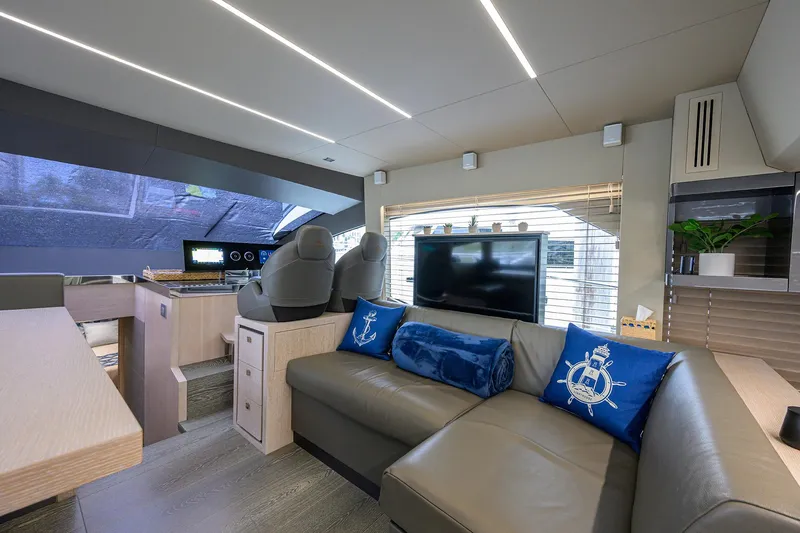 Harbour Time Yacht Photos Pics Luxurious interior of 2021 Astondoa 52 yacht with modern seating and entertainment area.