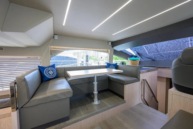Harbour Time Yacht Photos Pics Luxurious interior of 2021 Astondoa 52 yacht with modern seating and dining area.