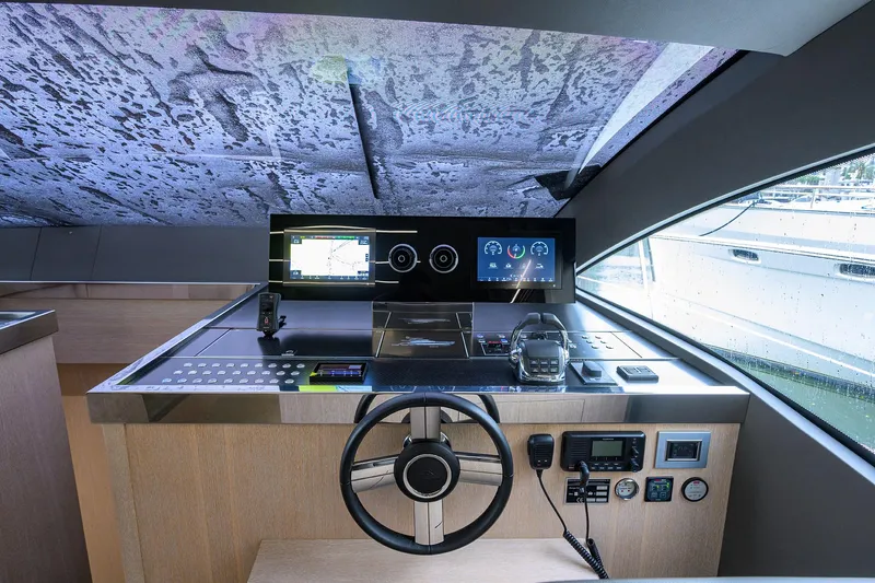 Harbour Time Yacht Photos Pics Helm of 2021 Astondoa 52 yacht with modern navigation controls and sleek design.