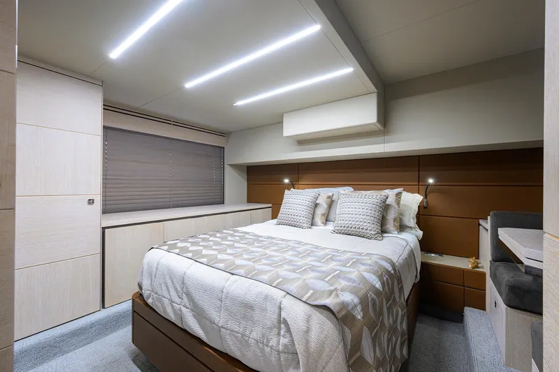 Harbour Time Yacht Photos Pics Luxurious bedroom interior of 2021 Astondoa 52 yacht with modern design and ambient lighting.