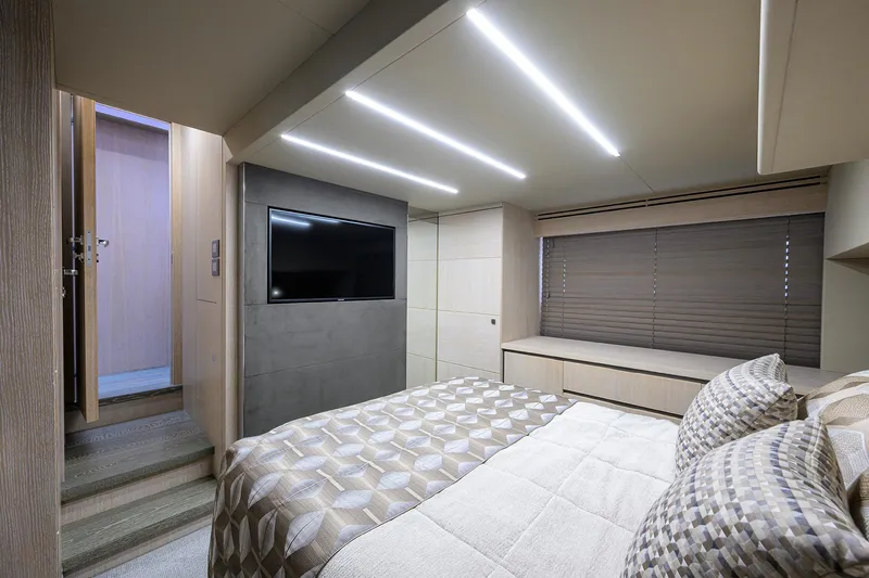 Harbour Time Yacht Photos Pics Luxurious bedroom interior of 2021 Astondoa 52 yacht with modern lighting and decor.