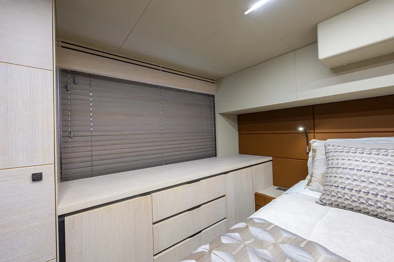 Harbour Time Yacht Photos Pics Luxurious bedroom interior of 2021 Astondoa 52 yacht with modern design and elegant furnishings.