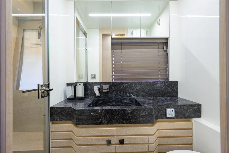 Harbour Time Yacht Photos Pics Luxurious bathroom in 2021 Astondoa 52 yacht with modern fixtures and sleek design.