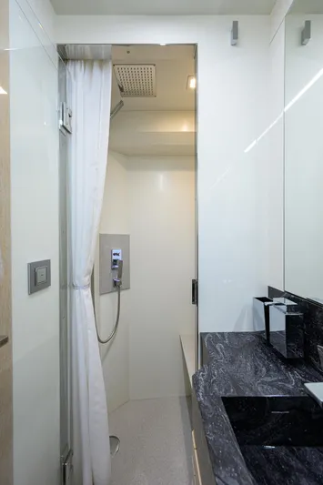 Harbour Time Yacht Photos Pics Modern bathroom in 2021 Astondoa 52 yacht with sleek shower and marble countertop.