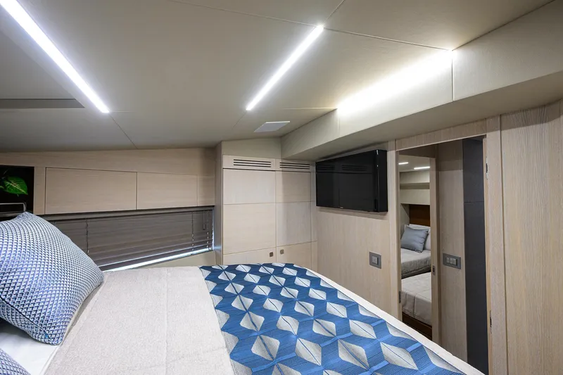 Harbour Time Yacht Photos Pics Luxurious bedroom interior of 2021 Astondoa 52 yacht with modern design and elegant lighting.