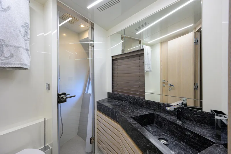Harbour Time Yacht Photos Pics Luxurious bathroom in 2021 Astondoa 52 yacht with modern fixtures and sleek design.