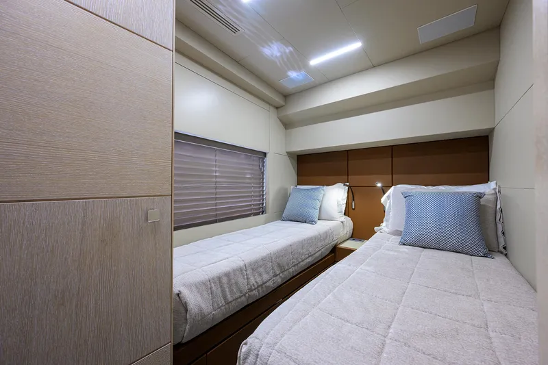 Harbour Time Yacht Photos Pics Twin cabin interior of 2021 Astondoa 52 yacht with modern design and cozy bedding.