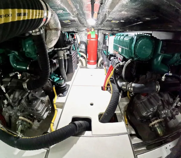 Docside Yacht Photos Pics Engine room of 2021 Galeon 430 HTC yacht, featuring dual engines and fire extinguisher.