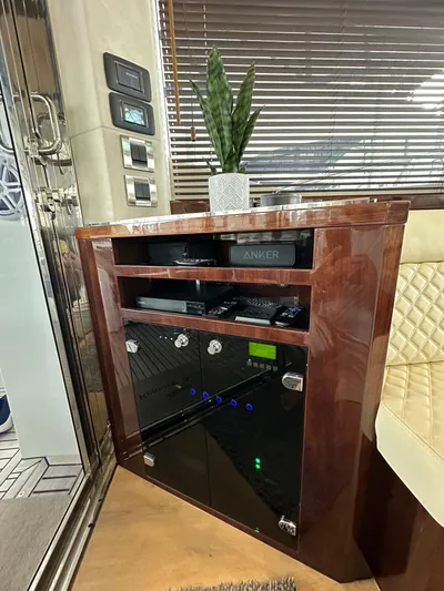 Docside Yacht Photos Pics Luxury interior of 2021 Galeon 430 HTC yacht with elegant wood cabinetry and modern controls.