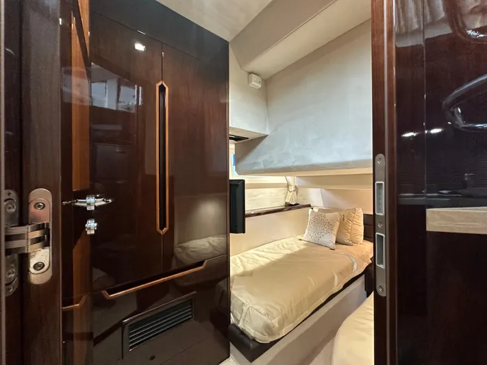 Docside Yacht Photos Pics Interior of 2021 Galeon 430 HTC yacht, featuring a cozy cabin with elegant wood finishes.