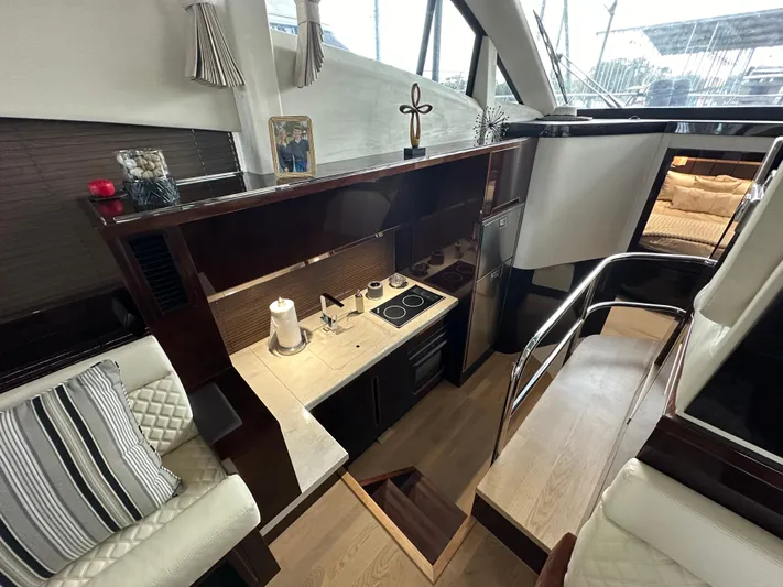 Docside Yacht Photos Pics Interior of 2021 Galeon 430 HTC yacht, featuring a modern kitchen and seating area.