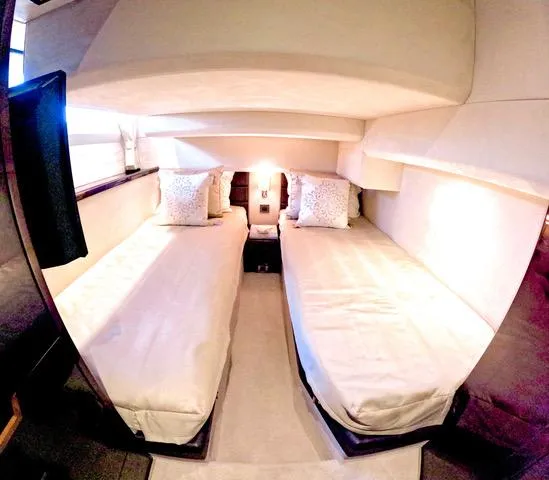 Docside Yacht Photos Pics Interior of 2021 Galeon 430 HTC yacht with twin beds and cozy lighting.