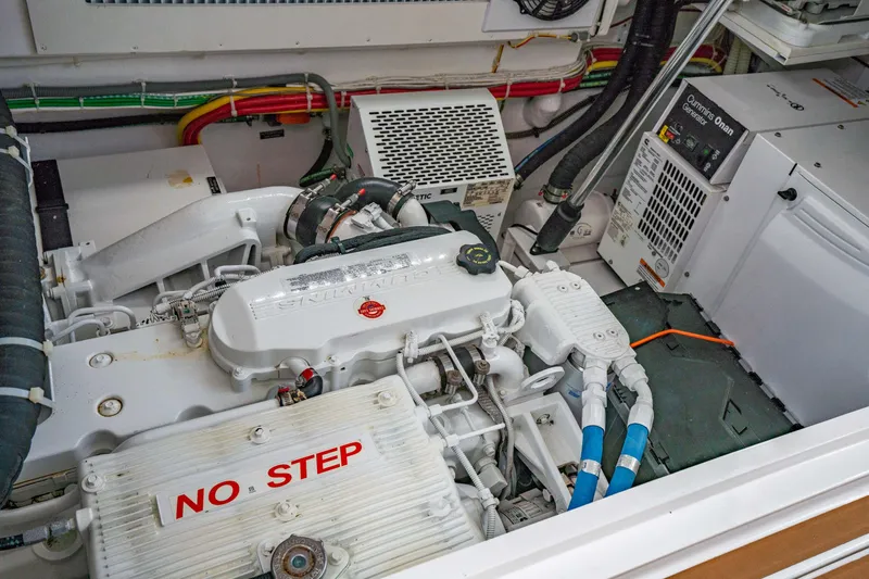 Fin Planner II Yacht Photos Pics Engine room of 2021 Viking 38 Billfish boat with visible machinery and "No Step" warning.