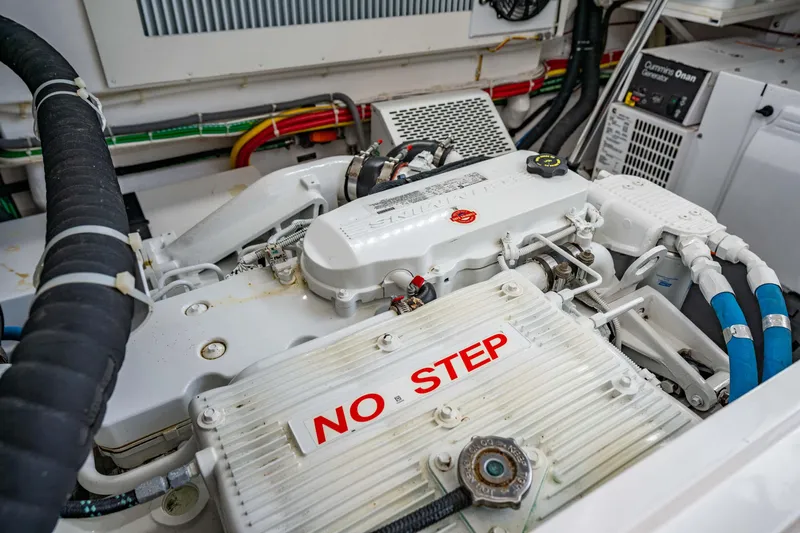 Fin Planner II Yacht Photos Pics Engine compartment of 2021 Viking 38 Billfish with "No Step" warning label.