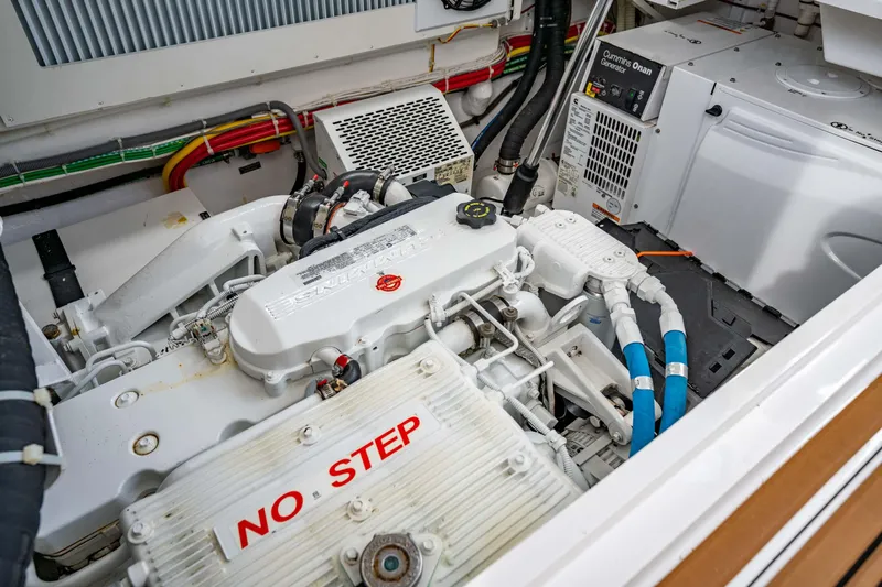 Fin Planner II Yacht Photos Pics Engine room of 2021 Viking 38 Billfish boat with visible components and "No Step" warning.
