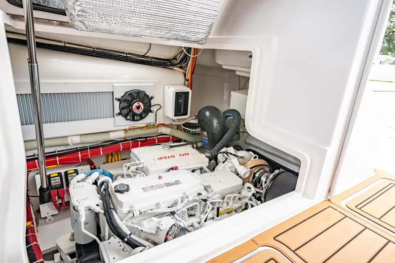 Fin Planner II Yacht Photos Pics Engine compartment of 2021 Viking 38 Billfish boat, showcasing detailed mechanical components.