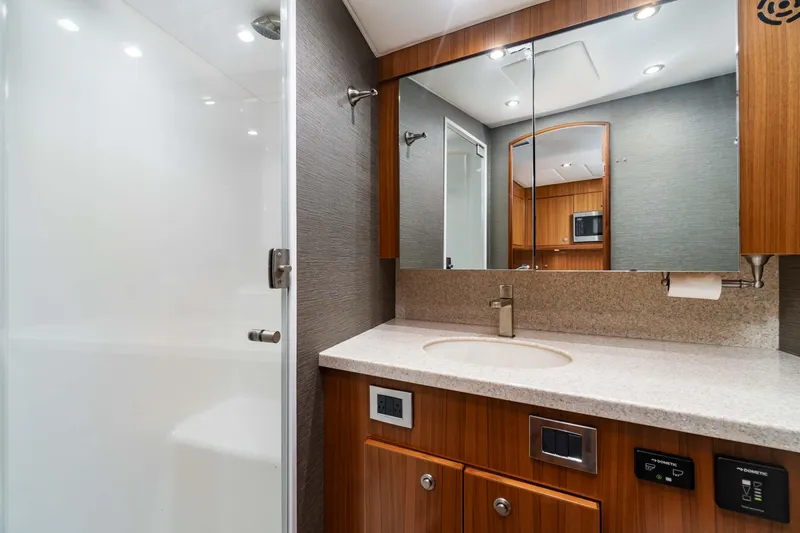 Fin Planner II Yacht Photos Pics Luxurious bathroom interior of 2021 Viking 38 Billfish yacht with modern fixtures.