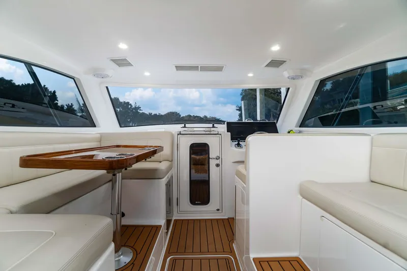 Fin Planner II Yacht Photos Pics Interior of 2021 Viking 38 Billfish yacht with modern seating and wooden flooring.