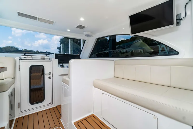 Fin Planner II Yacht Photos Pics Interior of 2021 Viking 38 Billfish yacht with seating and modern amenities.