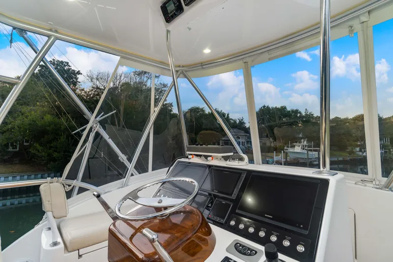 Fin Planner II Yacht Photos Pics Interior view of 2021 Viking 38 Billfish helm with modern controls and panoramic windows.