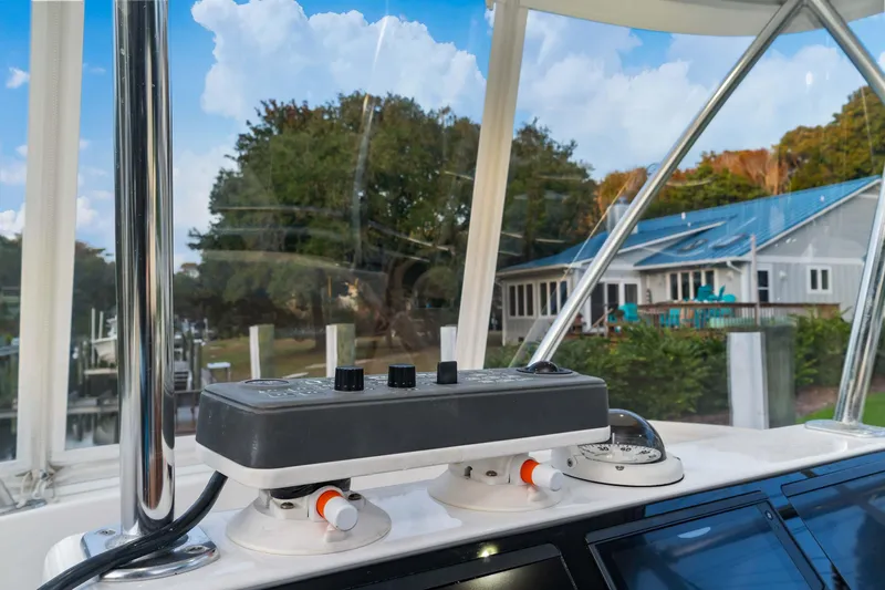 Fin Planner II Yacht Photos Pics Viking 38 Billfish 2021 helm controls with scenic marina view.