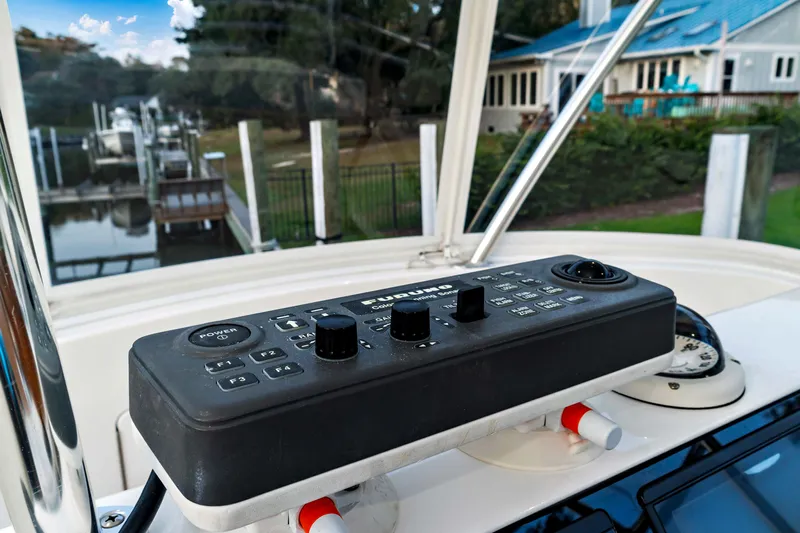Fin Planner II Yacht Photos Pics Control panel on 2021 Viking 38 Billfish boat, docked near waterfront property.