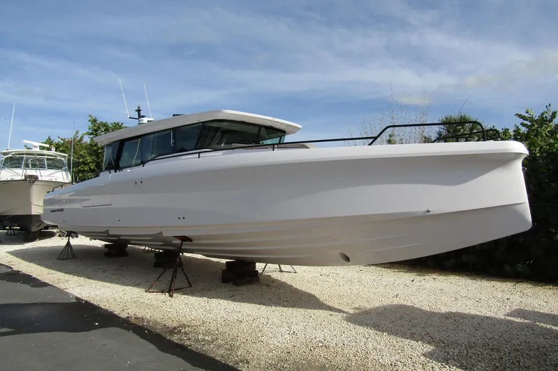  Yacht Photos Pics 2024 Axopar 45 XC Cross Cabin BRABUS Trim boat on display outdoors.