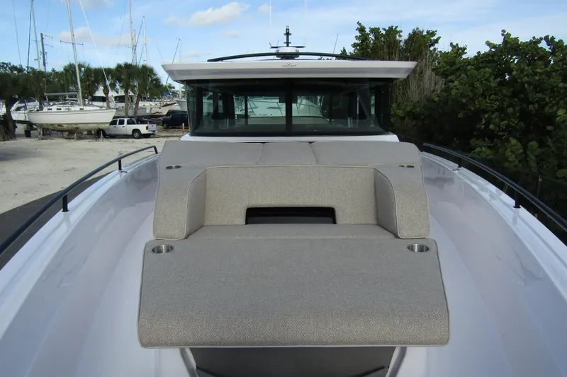  Yacht Photos Pics 2024 Axopar 45 XC Cross Cabin BRABUS Trim with sleek deck seating and modern design.