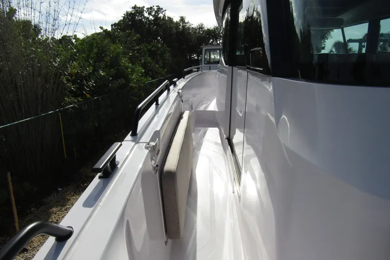  Yacht Photos Pics 2024 Axopar 45 XC Cross Cabin BRABUS Trim, sleek side deck view.